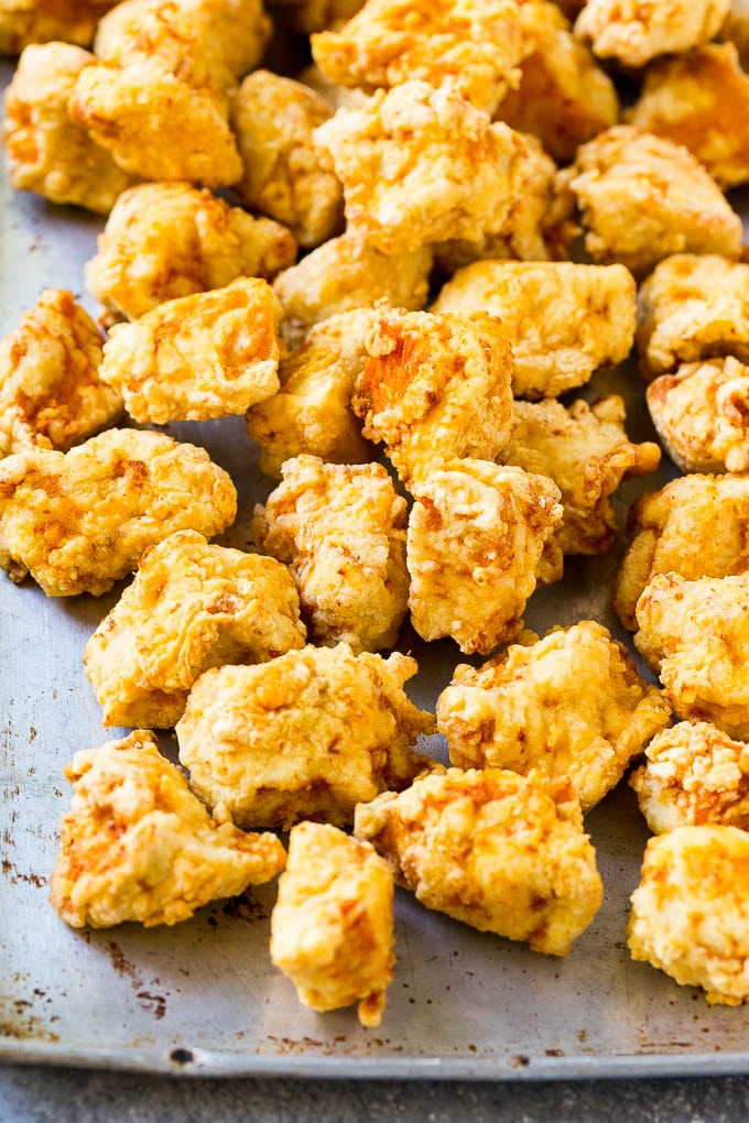Sweet Chili Chicken Recipe | Thai Chicken | Asian Chicken #chicken #thaifood #chili #dinner #bajap Fried chicken breast pieces on a sheet pan.