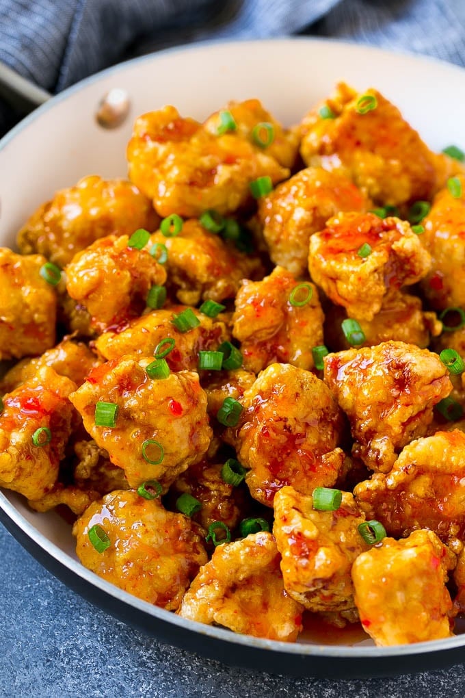 Sweet Chili Chicken Recipe | Thai Chicken | Asian Chicken #chicken #thaifood #chili #dinner #bajap Sweet chili chicken in a skillet, topped with sliced green onions.