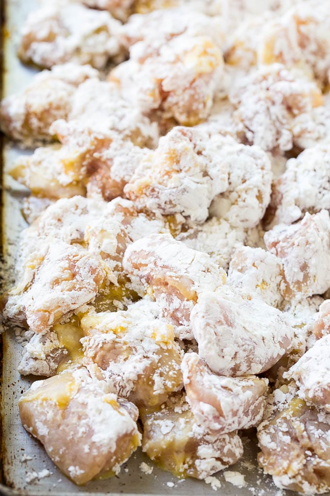 Sweet Chili Chicken Recipe | Thai Chicken | Asian Chicken #chicken #thaifood #chili #dinner #bajap Chicken pieces coated in egg and flour.