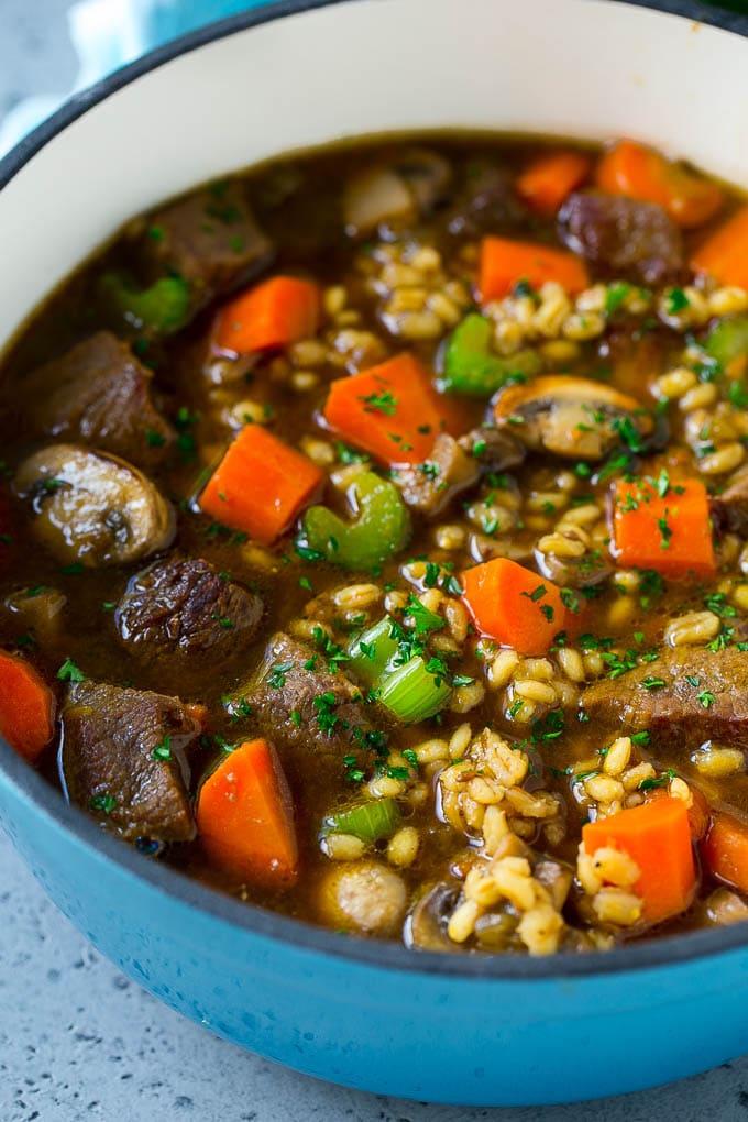 Beef Barley Soup Recipe | Beef Soup | Barley Soup #soup #beef #dinner #vegetables #bajap #comfortfood A pot of beef barley soup with mushrooms, carrots and celery.