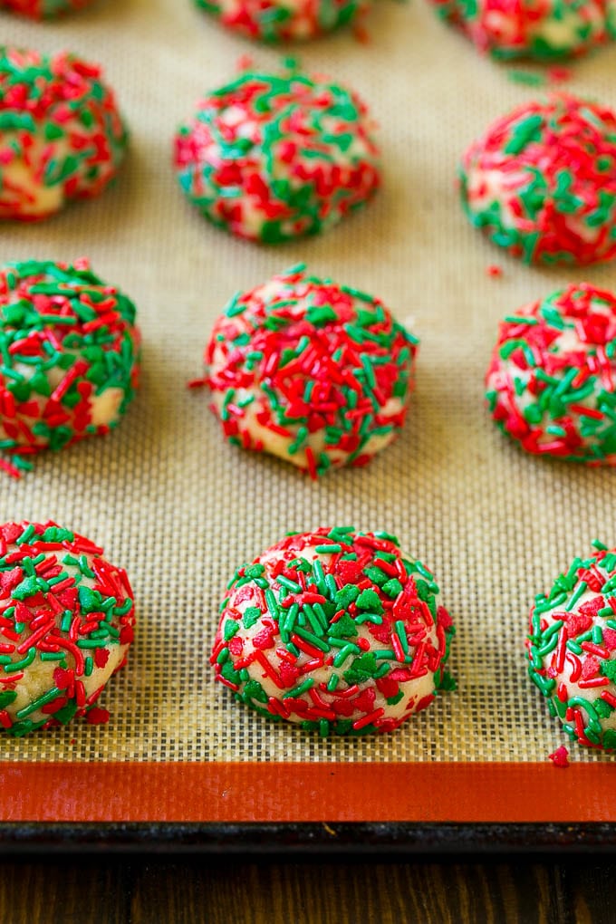 Cake Mix Cookies Recipe | Sprinkle Cookies | Christmas Cookies #cookies #christmas #sprinkles #dessert #baking #bajap Balls of dough rolled in sprinkles.