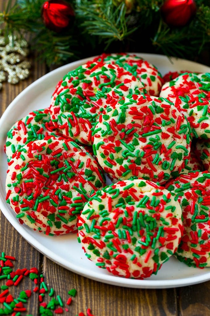 Cake Mix Cookies Recipe | Sprinkle Cookies | Christmas Cookies #cookies #christmas #sprinkles #dessert #baking #bajap A plate of cake mix cookies rolled in colorful sprinkles.