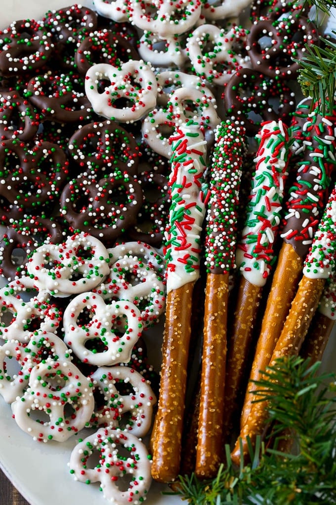 Chocolate Covered Pretzels Recipe | Sprinkle Pretzels | No Bake Dessert #pretzels #chocolate #christmas #sprinkles #candy #bajap Chocolate covered pretzel twists and rods on a serving platter.
