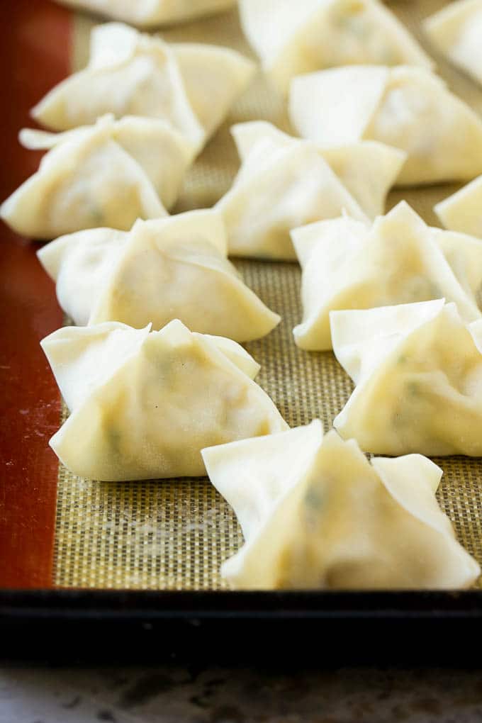 Crab Rangoon Recipe | Crab Wontons | Cream Cheese Wontons #crab #cheese #appetizer #snack #chinesefood #dinner #bajap Raw wontons ready to go into the fryer.