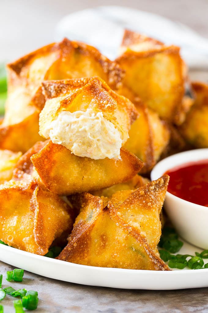Crab Rangoon Recipe | Crab Wontons | Cream Cheese Wontons #crab #cheese #appetizer #snack #chinesefood #dinner #bajap A cross section of crab rangoon with crispy wontons stuffed with cream cheese and crab.