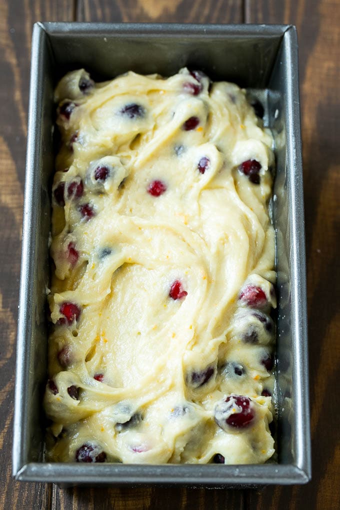 Cranberry Bread Recipe | Cranberry Loaf | Cranberry Orange Bread #cranberry #bread #baking #dessert #fall #bajap Ccranberry bread batter spread into a loaf pan.
