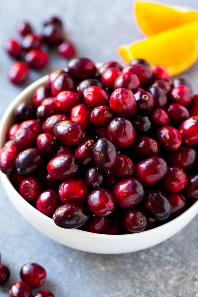 Cranberry Orange Sauce Recipe | Homemade Cranberry Sauce | Fresh Cranberry Sauce #cranberry #orange #fall #thanksgiving #sauce #dinner #bajap A bowl of fresh cranberries.