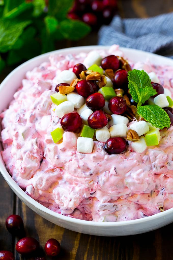Cranberry Salad Recipe | Fluff Salad #cranberry #salad #fall #dinner #bajap #thanksgiving Cranberry salad garnished with cranberries, marshmallows, pecans and apples.