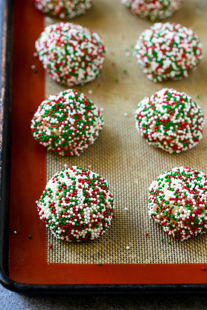 Gooey Butter Cookies Recipe | Cake Mix Cookies | Sprinkle Cookies | Christmas Cookies #cookies #butter #sprinkles #christmas #dessert #baking #bajap Balls of dough rolled in sprinkles.