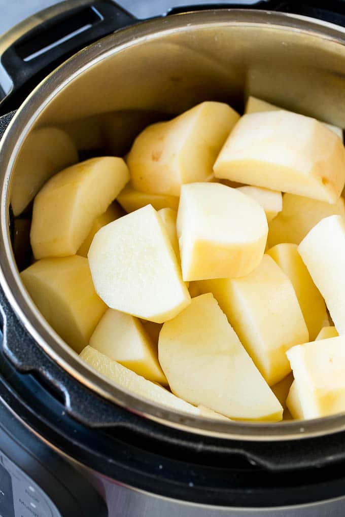 Instant Pot Mashed Potatoes Recipe | Pressure Cooker Mashed Potatoes | Easy Mashed Potatoes #potatoes #sidedish #instantpot #thanksgiving #dinner #bajap Peeled potatoes in an Instant Pot.