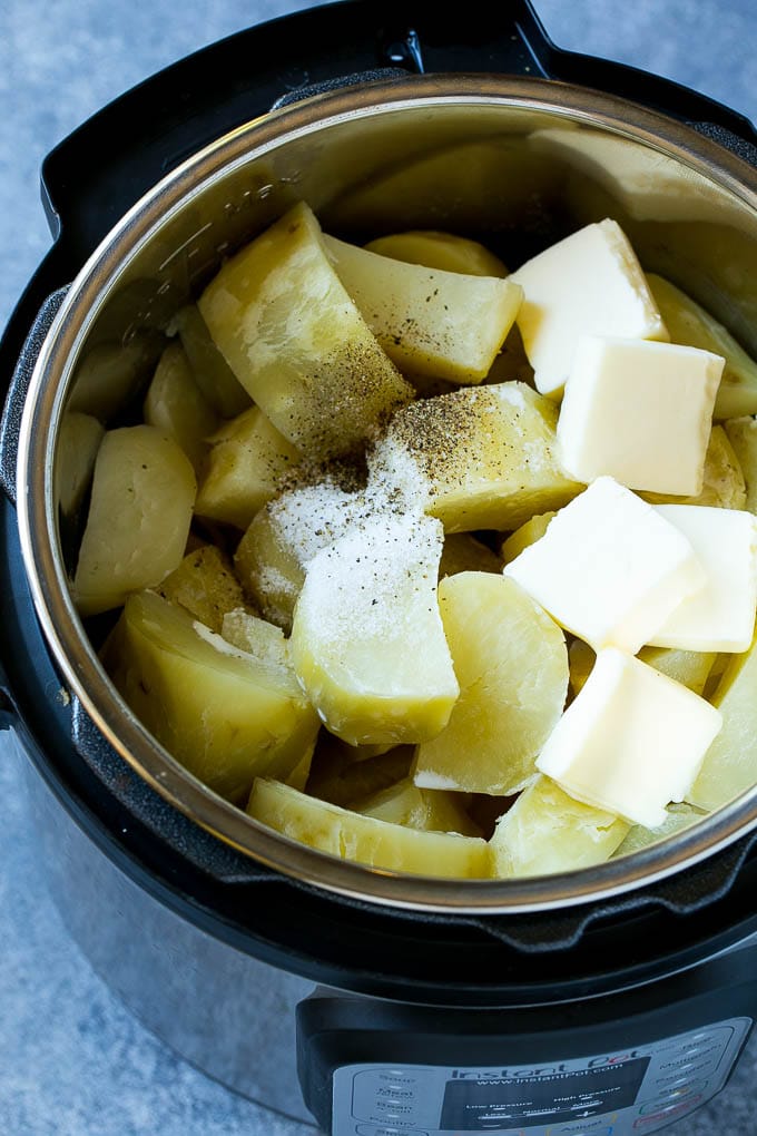 Instant Pot Mashed Potatoes Recipe | Pressure Cooker Mashed Potatoes | Easy Mashed Potatoes #potatoes #sidedish #instantpot #thanksgiving #dinner #bajap Cooked chunks of potatoes with butter, milk and seasonings in an Instant Pot.
