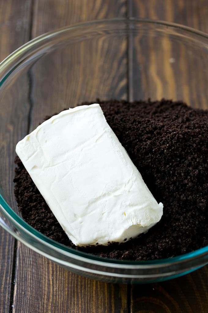 Oreo Balls Recipe | Oreo Truffles | Homemade Candy #truffles #candy #oreos #chocolate #sprinkles #dessert #christmas #bajap Cookie crumbs and cream cheese in a bowl.
