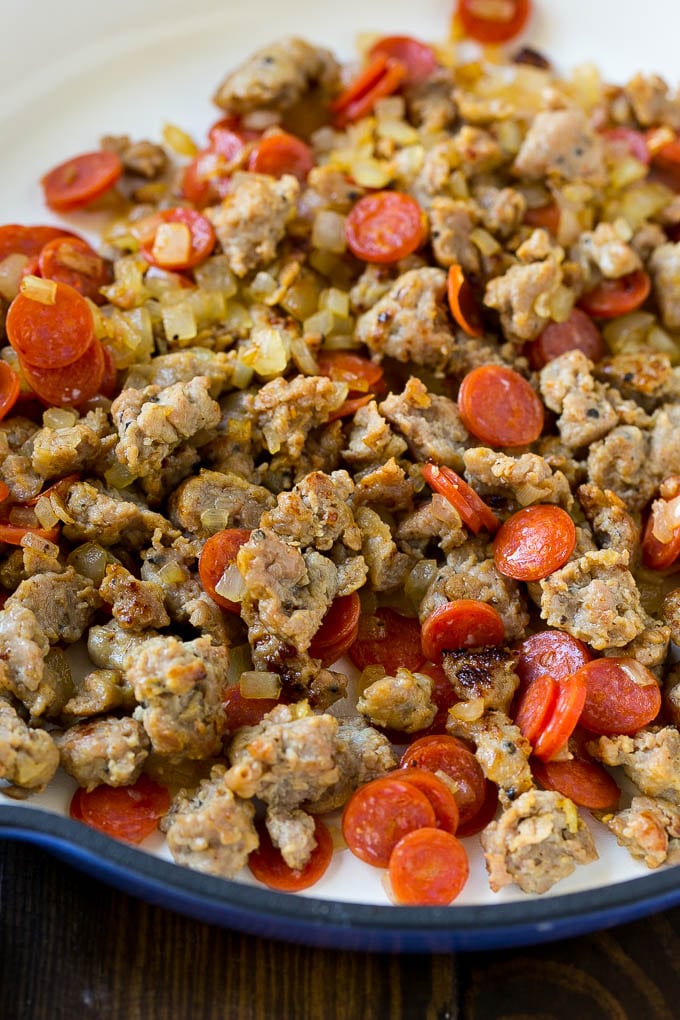 Pizza Pasta Recipe | Pepperoni Pasta | Sausage Pasta #italian #pepperoni #sausage #pizza #pasta #dinner #bajap #onepot A pan of cooked sausage, pepperoni and onions.