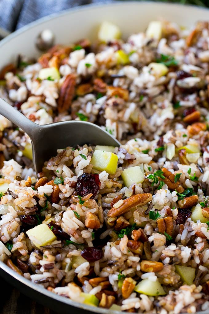 Wild Rice Pilaf Recipe | Thanksgiving Side Dish | Rice Pilaf #rice #apple #cranberry #fall #glutenfree #thanksgiving #bajap A skillet of rice pilaf with apples, cranberries and pecans.