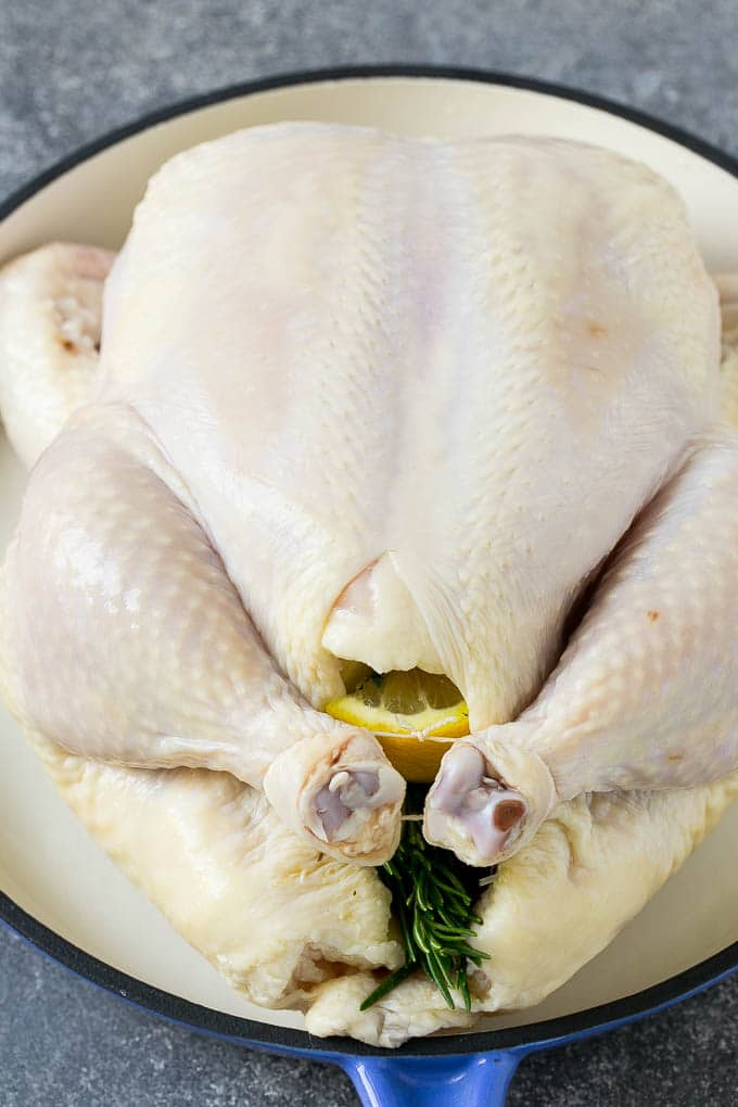 Roasted Chicken Recipe | Whole Roasted Chicken | Roast Chicken #chicken #dinner #lowcarb #keto #bajap A raw chicken stuffed with lemon, onion and herbs.