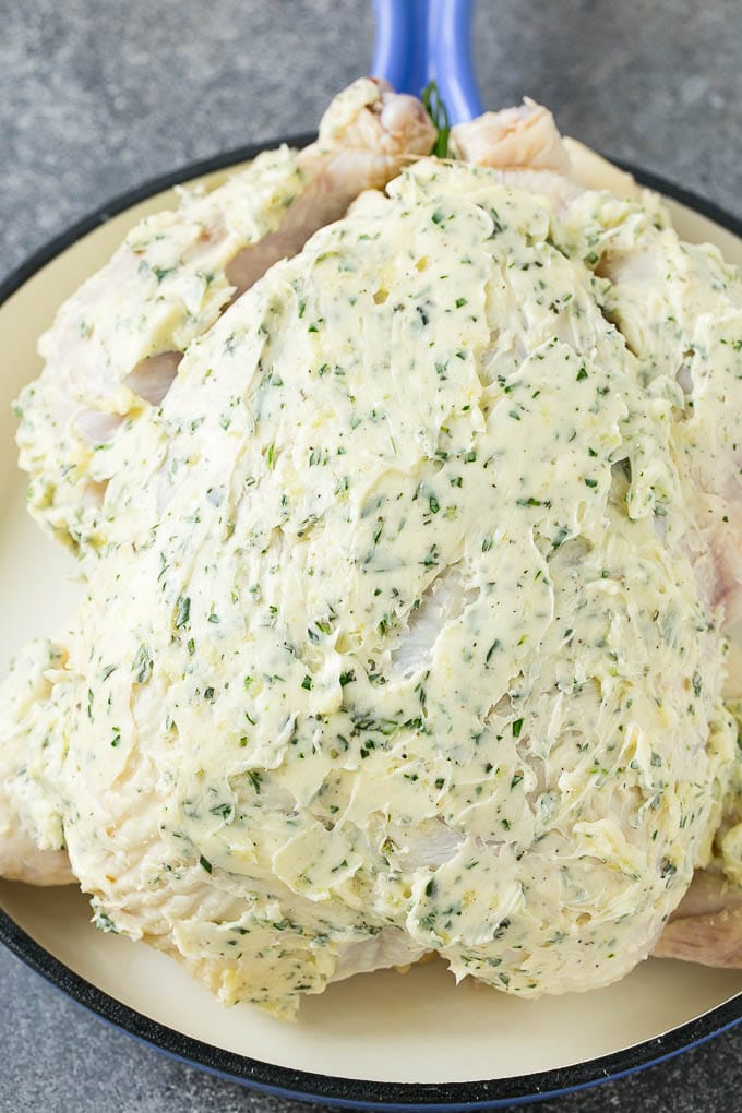 Roasted Chicken Recipe | Whole Roasted Chicken | Roast Chicken #chicken #dinner #lowcarb #keto #bajap A raw whole chicken coated in garlic and herb butter.