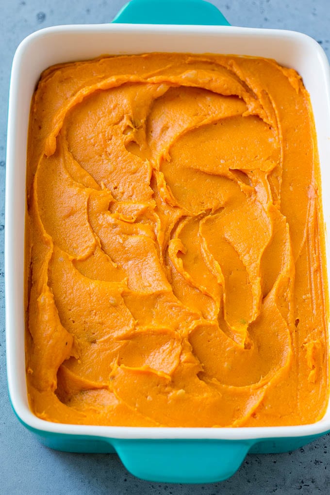 Ruth's Chris Sweet Potato Casserole Recipe | Sweet Potato Casserole | Mashed Sweet Potatoes #sweetpotatoes #casserole #thanksgiving #christmas #holidays #dinner #bajap #sidedish A pan of mashed sweet potatoes.