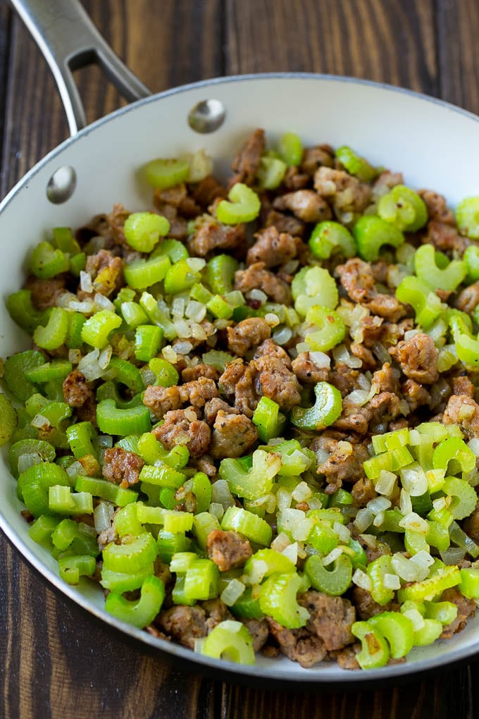 Sausage Stuffing Recipe | Thanksgiving Stuffing | Make Ahead Stuffing #stuffing #thanksgiving #sausage #sidedish #dinner #bajap A pan of cooked sausage, celery and onions.
