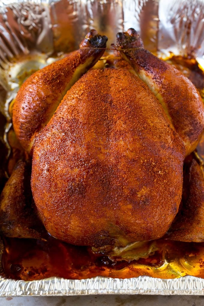 Smoked Chicken Recipe | Whole Smoked Chicken | BBQ Chicken #chicken #smoker #BBQ #dinner #bajap #glutenfree #lowcarb A whole smoked chicken in a roasting pan.