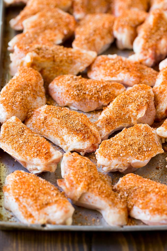 Smoked Chicken Wings | Barbecue Chicken Wings | BBQ Chicken Wings #chicken #wings #bbq #barbecue #appetizer #dinner #bajap Raw chicken wings coated in homemade spice rub on a sheet pan.