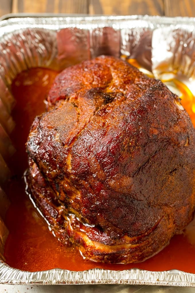 Brown Sugar Smoked Ham Recipe | Holiday Ham Recipe | Brown Sugar Glazed Ham #ham #christmas #thanksgiving #easter #smoker #dinner #brownsugar #bajap #glutenfree BBQ rub coating the meat.