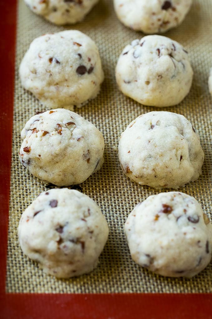 Snowball Cookies Recipe | Mexican Wedding Cookies | Russian Tea Cakes #cookies #pecan #chocolate #baking #dessert #christmas #bajap Baked snowball cookies on a sheet pan.