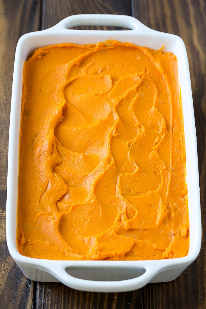 Sweet Potato Casserole with Pecans Recipe | Sweet Potato Casserole | Sweet Potato Side Dish #sweetpotatoes #thanksgiving #pecans #casserole #sidedish #holiday #fall #bajap Mashed sweet potatoes in a baking dish.