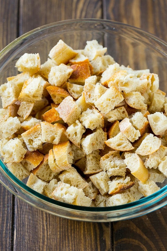 Turkey Stuffing Recipe | Thanksgiving Stuffing | Classic Stuffing #thanksgiving #stuffing #sidedish #fall #bajap Dried bread cubes in a mixing bowl.