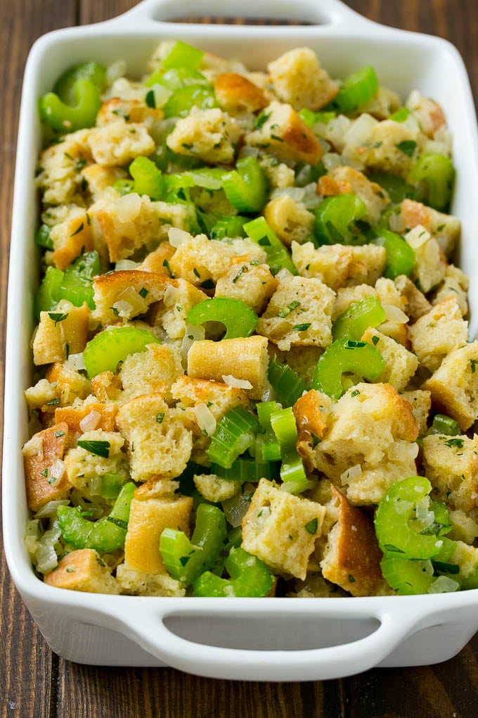 Turkey Stuffing Recipe | Thanksgiving Stuffing | Classic Stuffing #thanksgiving #stuffing #sidedish #fall #bajap Uncooked holiday stuffing in a baking dish.