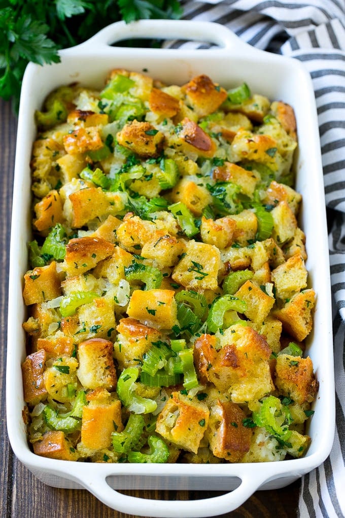 Turkey Stuffing Recipe | Thanksgiving Stuffing | Classic Stuffing #thanksgiving #stuffing #sidedish #fall #bajap Baked turkey stuffing in a dish topped with fresh parsley.