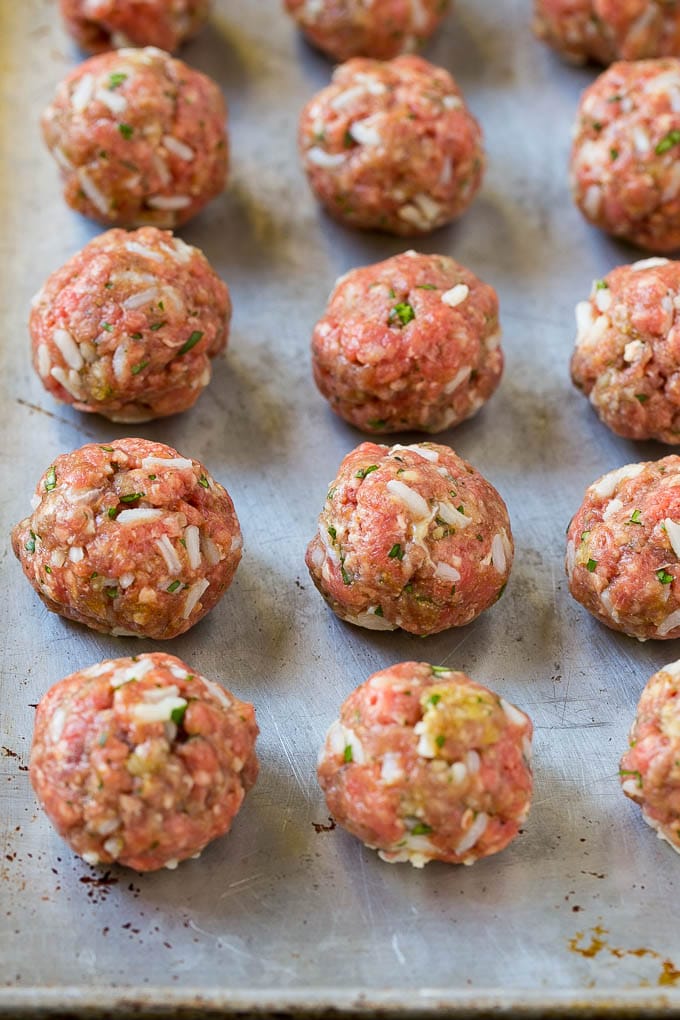 Albondigas Soup | Meatball Soup | Mexican Soup #soup #meatballs #beef #rice #glutenfree #dinner #bajap #comfortfood Uncooked beef and rice meatballs on a sheet pan.