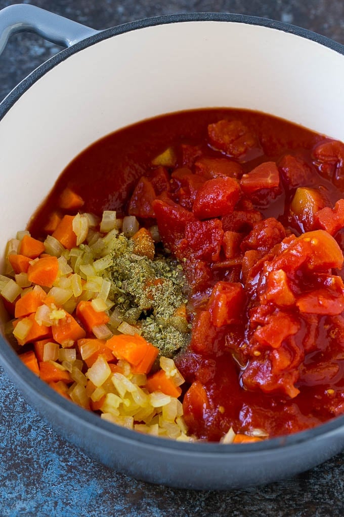 Albondigas Soup | Meatball Soup | Mexican Soup #soup #meatballs #beef #rice #glutenfree #dinner #bajap #comfortfood Vegetables, tomatoes and herbs in a soup pot.