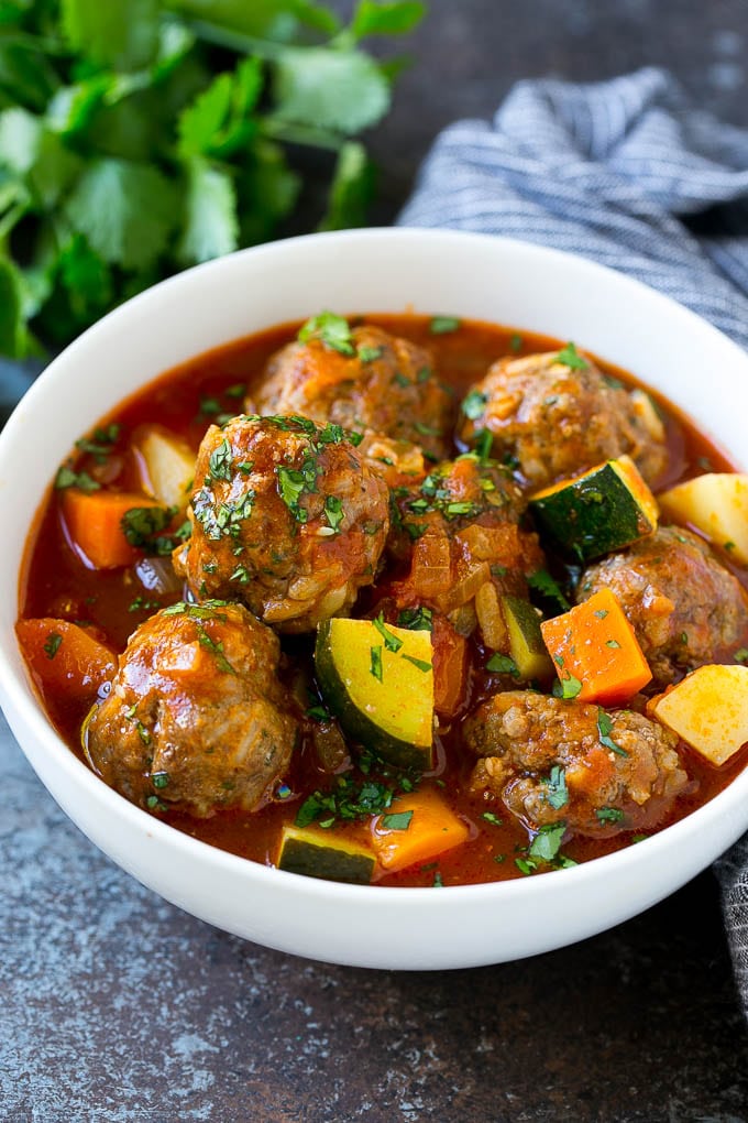 Albondigas Soup | Meatball Soup | Mexican Soup #soup #meatballs #beef #rice #glutenfree #dinner #bajap #comfortfood A bowl of albondigas soup with meatballs, carrots, zucchini and tomatoes.