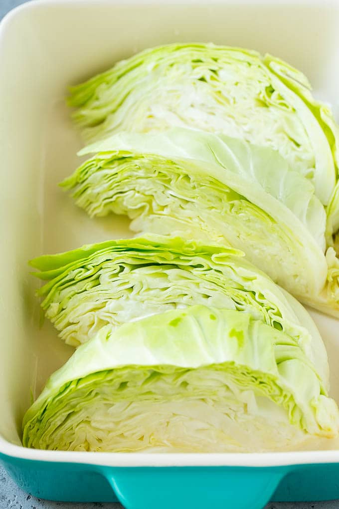 Braised Cabbage Recipe | Easy Cabbage Recipe #cabbage #lowcarb #keto #carrots #veggies #vegetarian #dinner #bajap Wedges of cabbage in a baking dish.