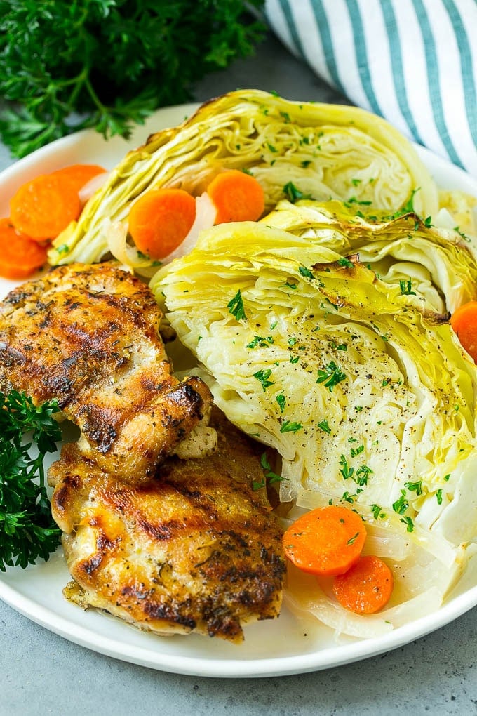 Braised Cabbage Recipe | Easy Cabbage Recipe #cabbage #lowcarb #keto #carrots #veggies #vegetarian #dinner #bajap A plate of grilled chicken along with braised cabbage, carrots and onions.