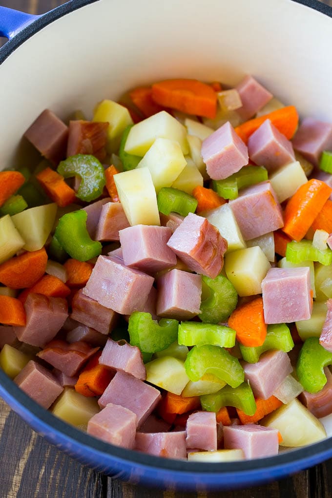 Ham and Potato Soup | Ham Soup | Potato Soup #soup #ham #potato #dinner #comfortfood #bajap Diced ham, carrots, potatoes and celery in a soup pot.
