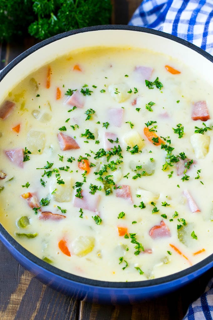 Ham and Potato Soup | Ham Soup | Potato Soup #soup #ham #potato #dinner #comfortfood #bajap A pot of ham and potato soup with vegetables in a creamy broth, topped with parsley.