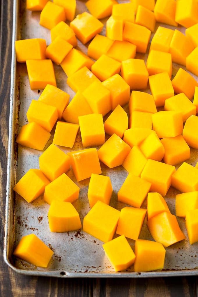 Roasted Butternut Squash Recipe | Baked Butternut Squash | Butternut Squash Side Dish #butternutsquash #squash #fall #vegetarian #dinner #bajap Raw cubed squash on a sheet pan.
