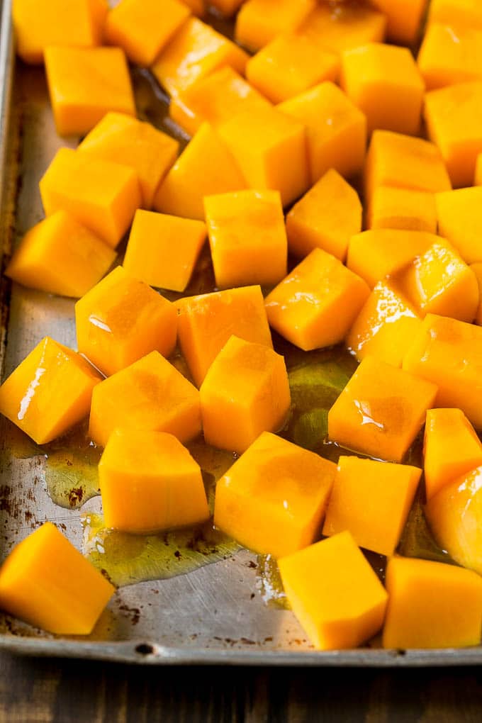 Roasted Butternut Squash Recipe | Baked Butternut Squash | Butternut Squash Side Dish #butternutsquash #squash #fall #vegetarian #dinner #bajap Cubes of winter squash coated in olive oil, brown sugar and maple syrup.