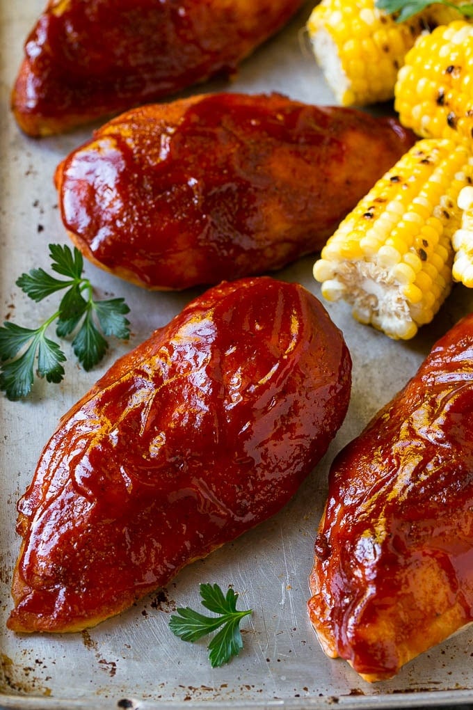 Smoked Chicken Breast Recipe | BBQ Chicken | Smoked Chicken #bbq #chicken #smoker #dinner #glutenfree #bajap Smoked chicken breasts on a sheet pan with corn on the corn and fresh herbs.