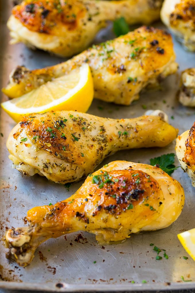 Baked Chicken Drumsticks Recipe | Roasted Chicken Drumsticks | Garlic and Herb Chicken #dinner #chicken #garlic #glutenfree #lowcarb #keto #cleaneating #bajap Baked chicken drumsticks flavored with garlic and herbs, then garnished with lemon wedges and parsley.