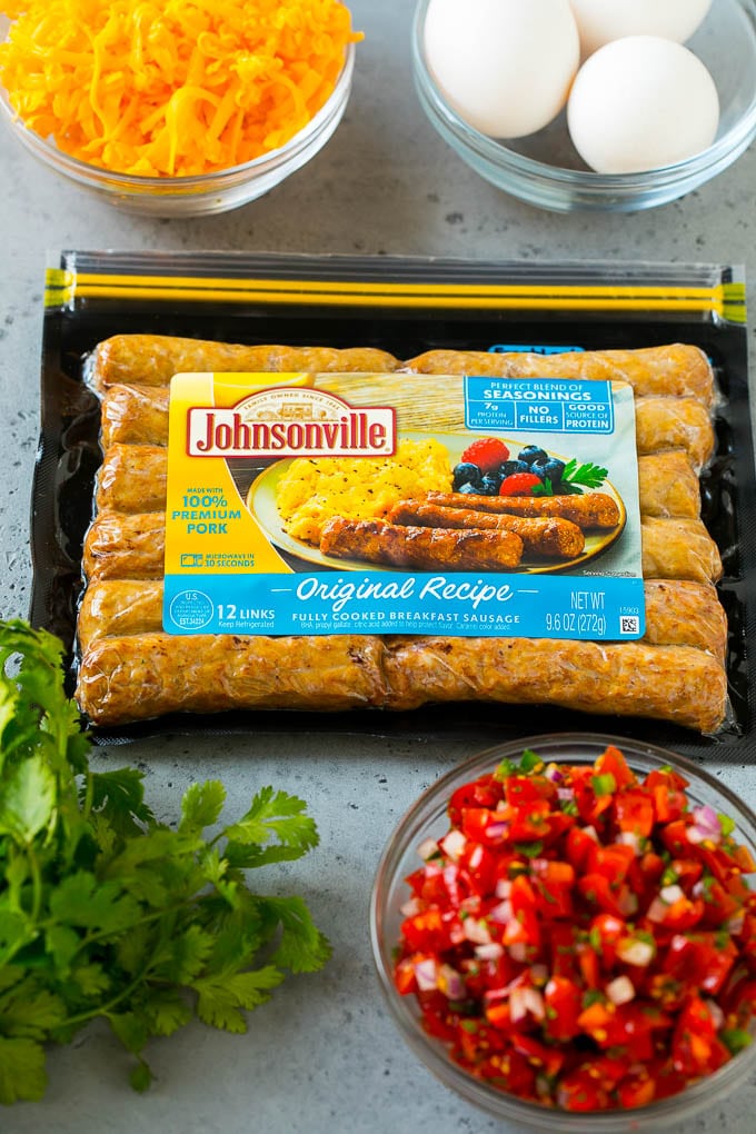 Breakfast Burrito Recipe | Sausage Breakfast Burrito #breakfast #sausage #eggs #burrito #bajap A package of sausage links along with bowls of pico de gallo, eggs and shredded cheese.