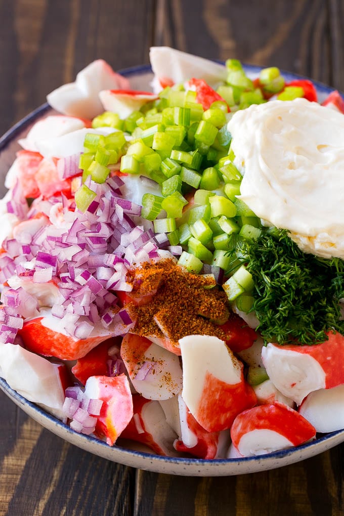 Crab Salad Recipe | Seafood Salad | Deli Salad #crab #salad #seafood #lowcarb #keto #lunch #dinner #bajap Imitation crab, seasoning, dill, celery and mayonnaise in a bowl.