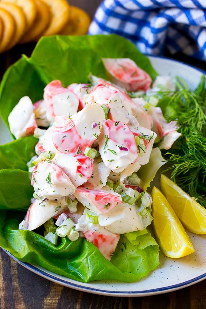 Crab Salad Recipe | Seafood Salad | Deli Salad #crab #salad #seafood #lowcarb #keto #lunch #dinner #bajap Crab salad served on a bed of lettuce with a side of crackers.