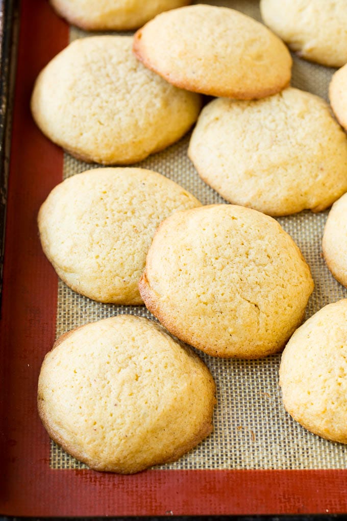 Eggnog Cookies Recipe | Holiday Cookies | Christmas Cookies #cookies #eggnog #baking #christmas #sprinkles #dessert #bajap Baked eggnog cookies on a sheet pan.