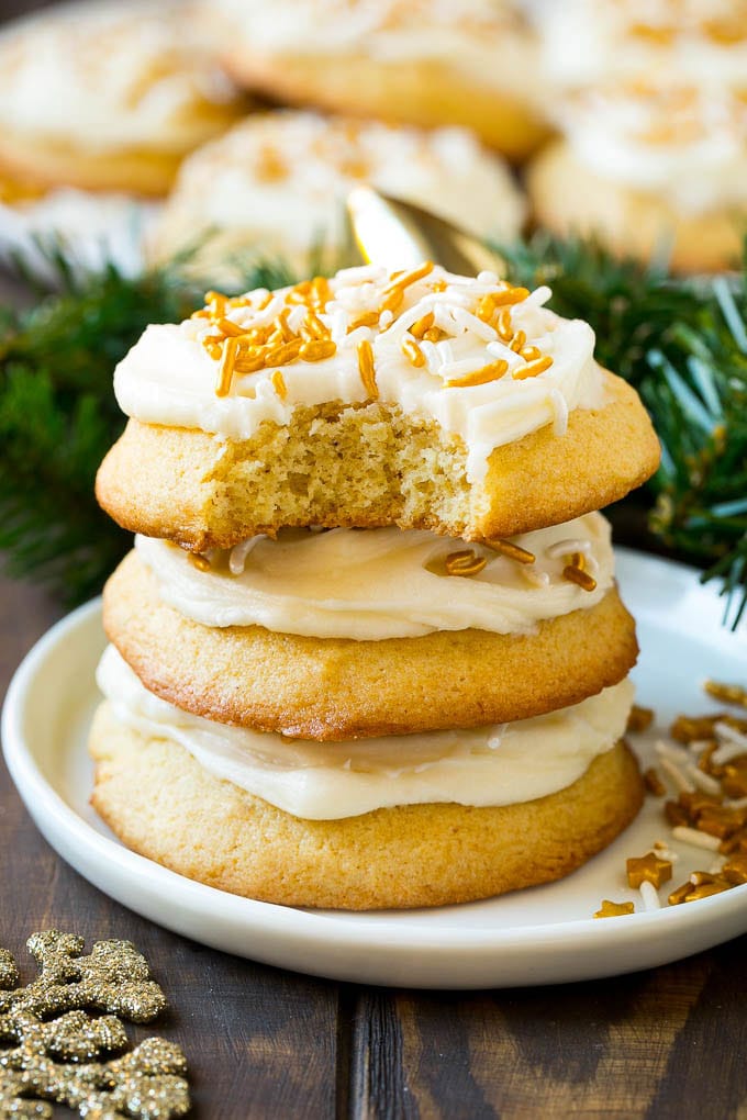Eggnog Cookies Recipe | Holiday Cookies | Christmas Cookies #cookies #eggnog #baking #christmas #sprinkles #dessert #bajap A stack of eggnog cookies with a bite taken out of one.