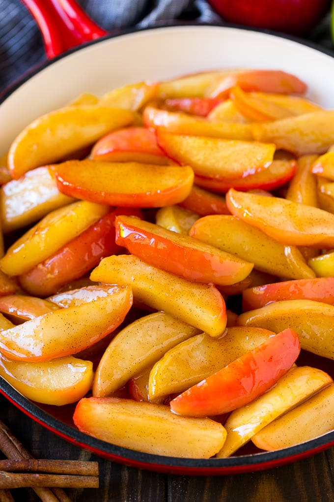 Fried Apples Recipe | Sauteed Apples | Cinnamon Sugar Apples #apples #cinnamon #sugar #sidedish #dessert #bajap #fall Southern fried apples coated in butter, cinnamon and sugar in a red skillet.