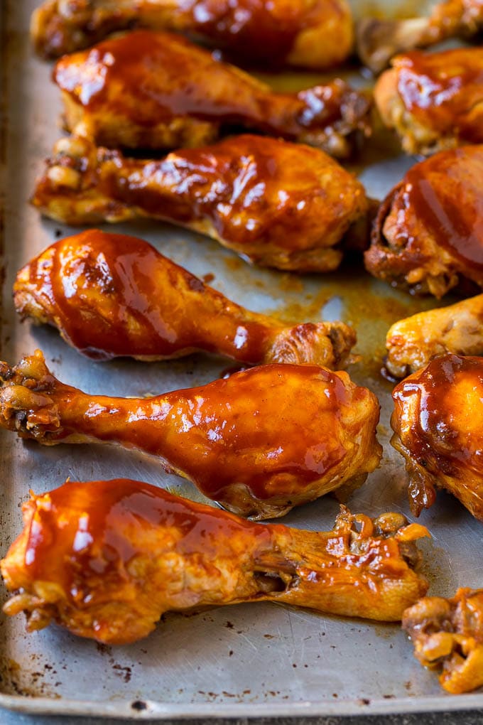 Slow Cooker Chicken Drumsticks Recipe | Crock Pot Chicken Drumsticks | BBQ Chicken Drumsticks #chicken #drumsticks #slowcooker #crockpot #bbq #dinner #bajap Slow cooker chicken drumsticks on a sheet pan, ready for the broiler.