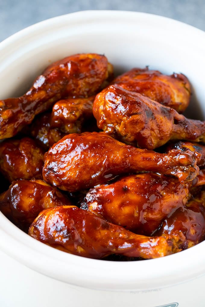 Slow Cooker Chicken Drumsticks Recipe | Crock Pot Chicken Drumsticks | BBQ Chicken Drumsticks #chicken #drumsticks #slowcooker #crockpot #bbq #dinner #bajap Slow cooker chicken drumsticks coated in BBQ sauce inside a crock pot.