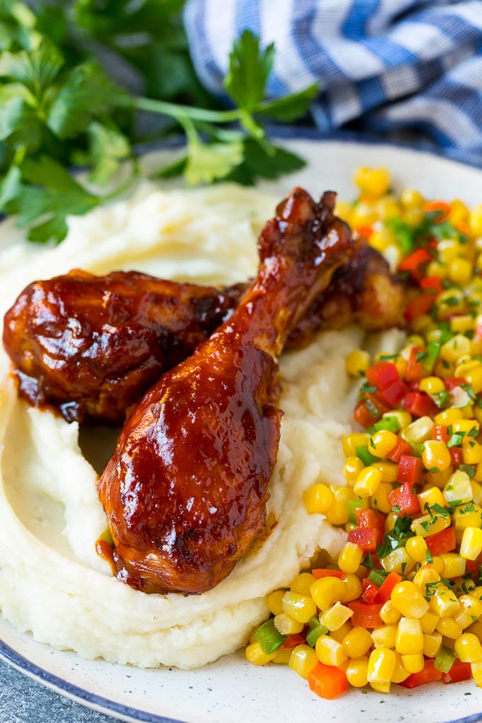 Slow Cooker Chicken Drumsticks Recipe | Crock Pot Chicken Drumsticks | BBQ Chicken Drumsticks #chicken #drumsticks #slowcooker #crockpot #bbq #dinner #bajap Slow cooker chicken drumsticks served with mashed potatoes and corn.
